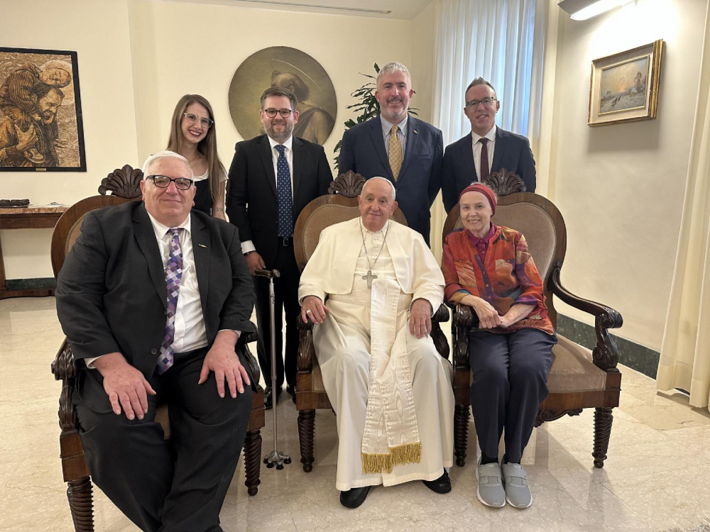 Pope Francis poses for a photo with a delegation from New Ways Ministry, including transgender and intersex Catholics, during a meeting at his residence at the Vatican Oct. 12, 2024. Pictured from left are Francis DeBernardo, Bernadette Donlon, Robert Shine, Matthew Myers, Brian Flanagan and Loretto Sister Jeannine Gramick.(CNS/New Ways Ministry)