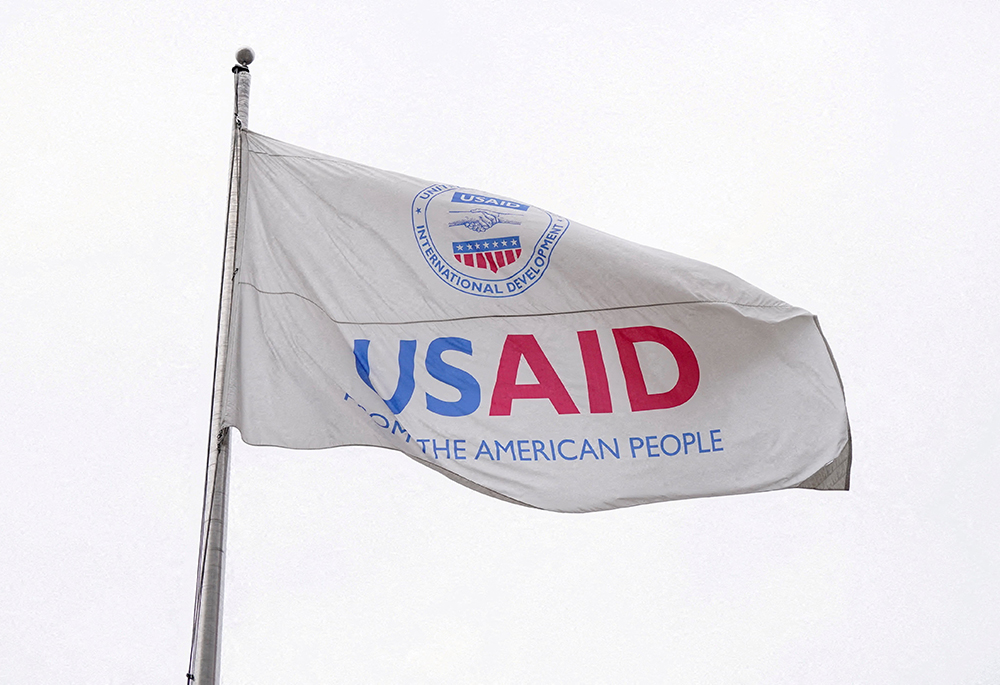 A flag flies outside the U.S. Agency for International Development building in Washington Feb. 3, 2025, as the agency sits closed to employees after a memo was issued advising USAID personnel to work remotely. (OSV News/Reuters/Kent Nishimura)
