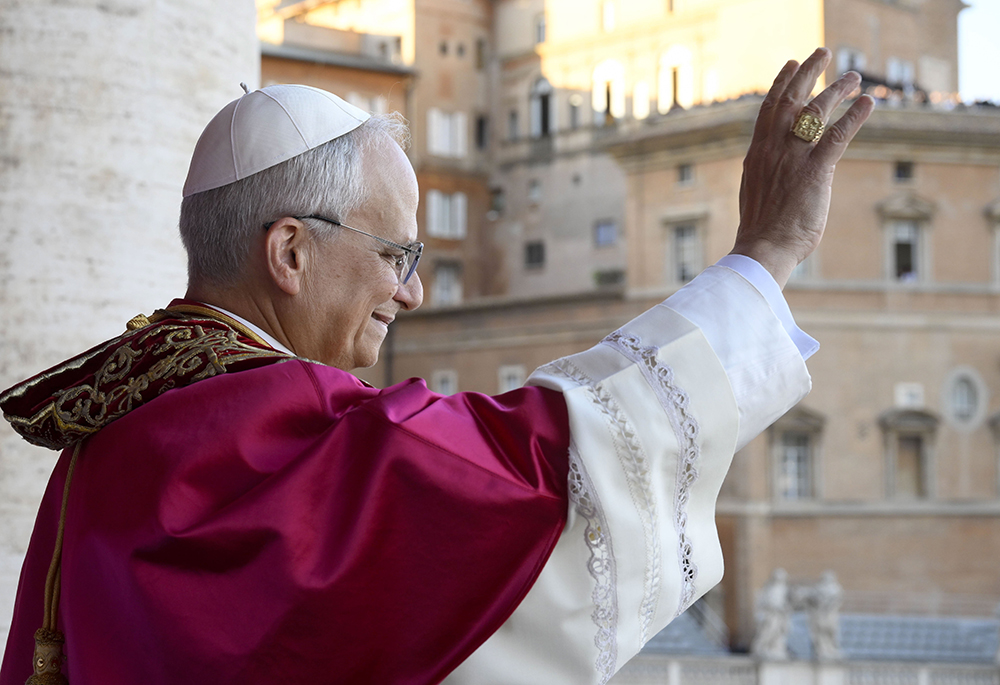 Pope Leo XIV, the former Cardinal Robert F. Prevost, waves to the crowds in St. Peter's Square at the Vatican after his election as pope May 8, 2025. (CNS/Vatican Media)
