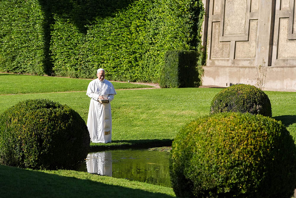 Pope Leo XIV feeds fish at a pond in the Pontifical Gardens of Castel Gandolfo, Italy, Sept. 5, 2025. The pope inaugurated Borgo Laudato Si’ the same day, opening the historic papal residence as a center dedicated to the principles of care for creation and human dignity outlined in Pope Francis’ encyclical Laudato Si’. (CNS/Lola Gomez)