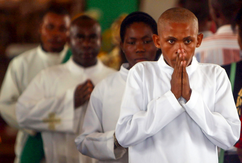 Choir members pictured in a file photo pray during Mass at the main cathedral in the port city of Bata, Equatorial Guinea. (OSV News/Reuters/Amr Abdallah Dalsh)