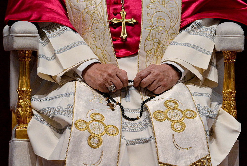 Pope Leo XIV prays the rosary for peace during an evening prayer vigil in St. Peter's Basilica at the Vatican April 11, 2026. (CNS/Vatican Media)