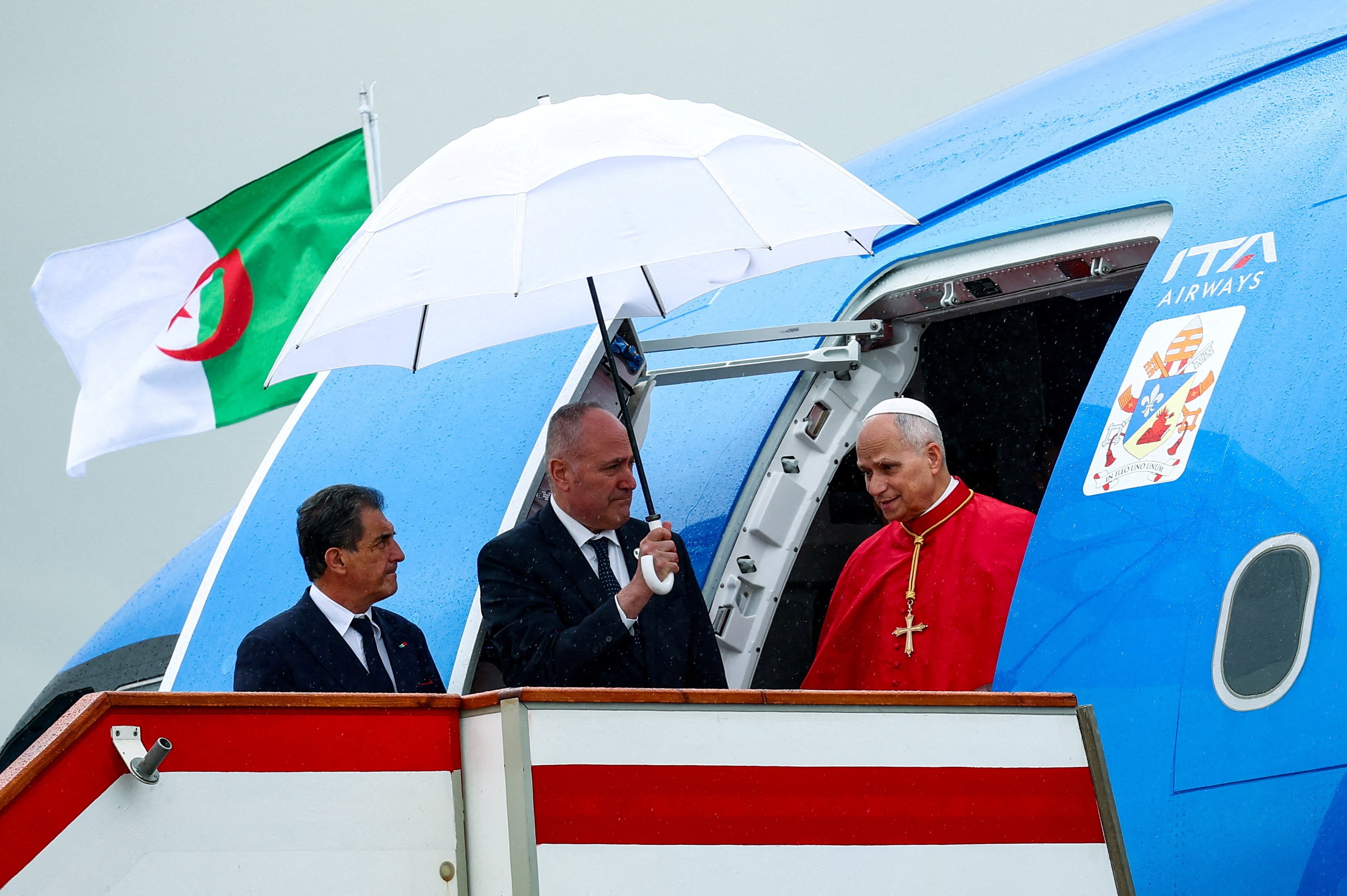 Pope Leo XIV disembarks the papal plane upon his arrival at Houari Boumediene International Airport to begin his apostolic journey to Algeria, Angola, Cameroon and Equatorial Guinea, in Dar El Beida, Algiers, Algeria, April 13, 2026. (OSV News photo/Guglielmo Mangiapane, Reuters)