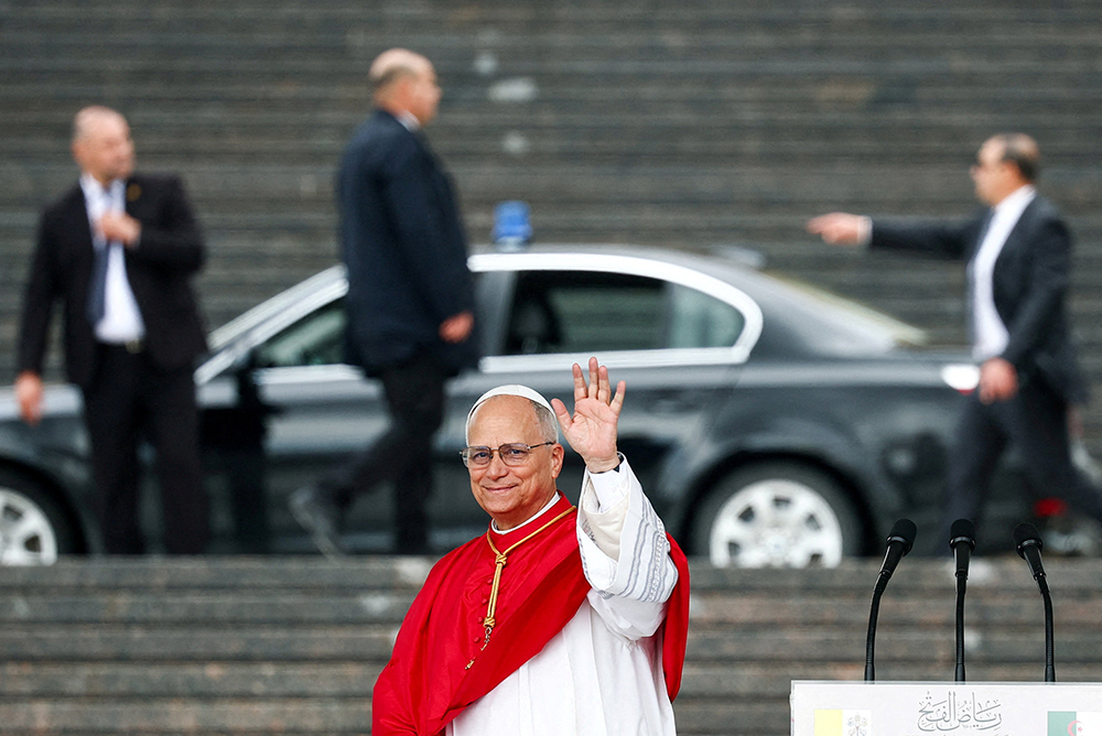 Pope Leo XIV waves following a speech at Maqam Echahid (Martyr's Memorial) in El Madania municipality in Algiers, Algeria, April 13, 2026. (OSV News/Guglielmo Mangiapane, pool via Reuters)
