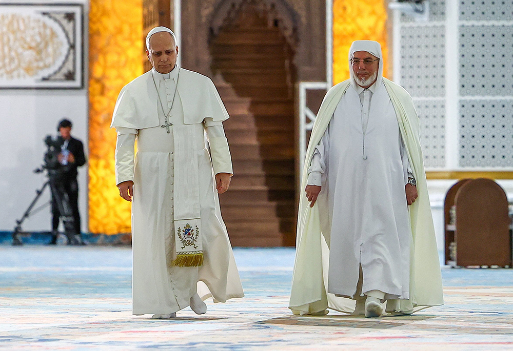 Pope Leo XIV and Rector of the Great Mosque of Algiers Mohamed Mamoun Al Qasimi during a visit to the Great Mosque of Algiers (Djamaa El Djazair), in Mohamadia, Algiers, Algeria, April 13, 2026. (OSV News/Reuters/Guglielmo Mangiapane)