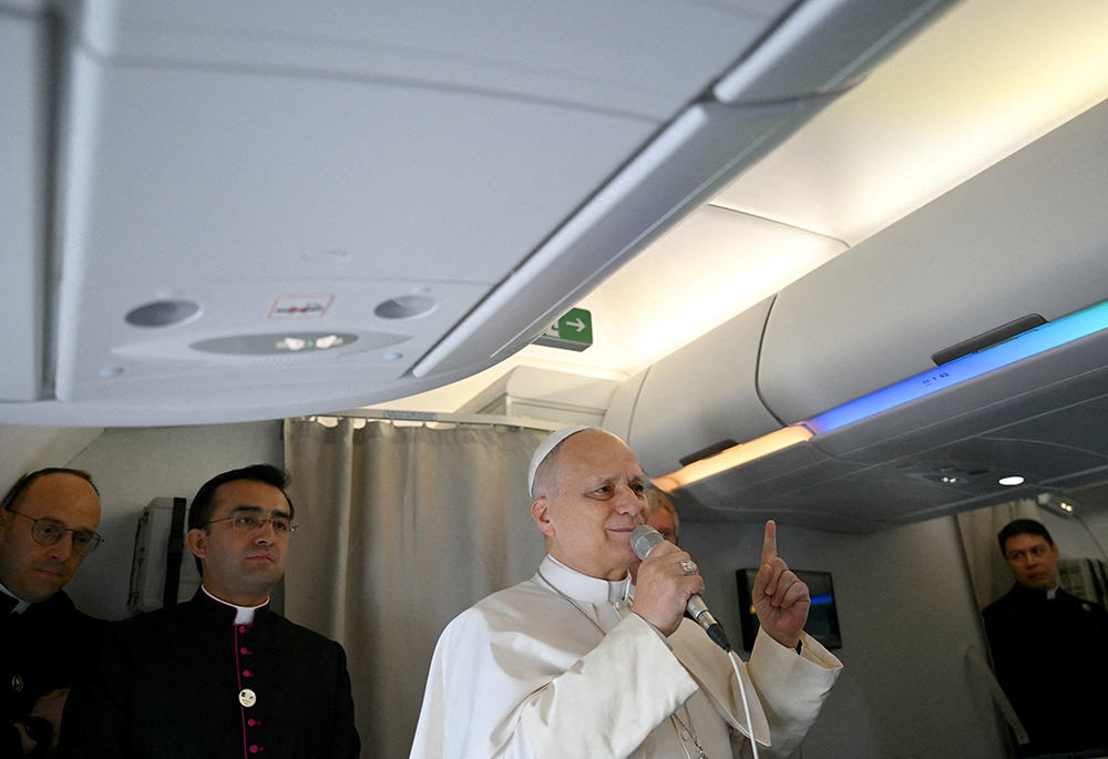 Pope Leo XIV addresses journalists during the flight heading to Algiers on April 13, 2026. U.S.-born Leo pushed back that day on President Donald Trump's broadside against him over the U.S.-Israel war in Iran, telling reporters that the Vatican's appeals for peace and reconciliation are rooted in the Gospel, and that he doesn't fear the Trump administration. (OSV News/Alberto Pizzoli, pool via Reuters)