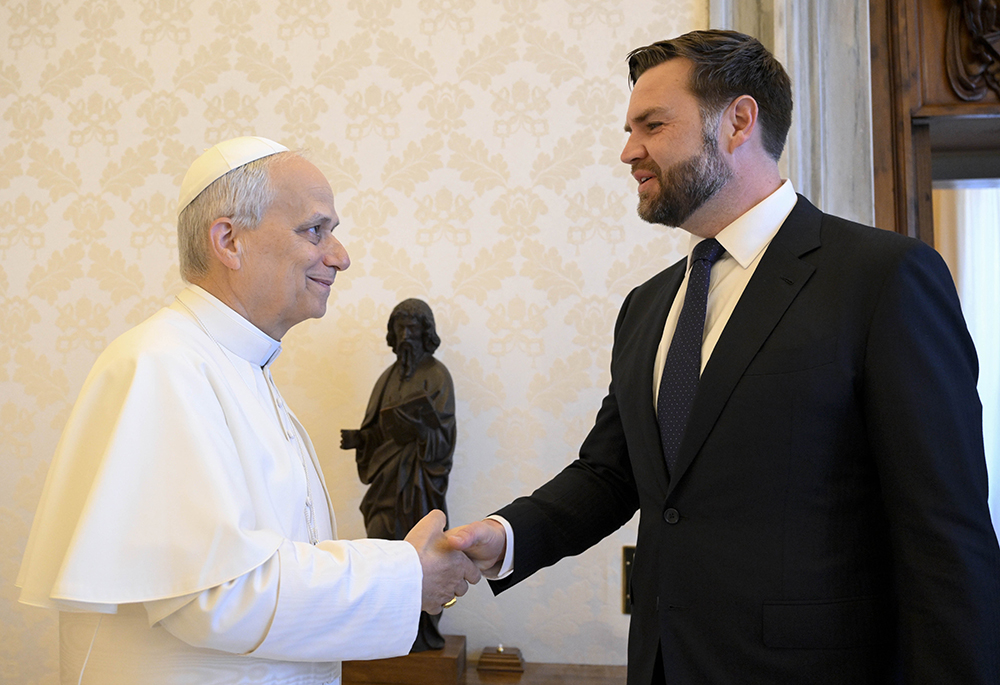 Pope Leo XIV shakes hands with U.S. Vice President JD Vance in the library of the Apostolic Palace at the Vatican May 19, 2025. (CNS/Vatican Media)