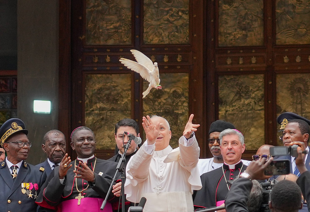 Pope Leo XIV releases a dove with community representatives at the conclusion of a peace meeting at St. Joseph Cathedral in Bamenda, Cameroon, April 16, 2026. (CNS/Lola Gomez)
