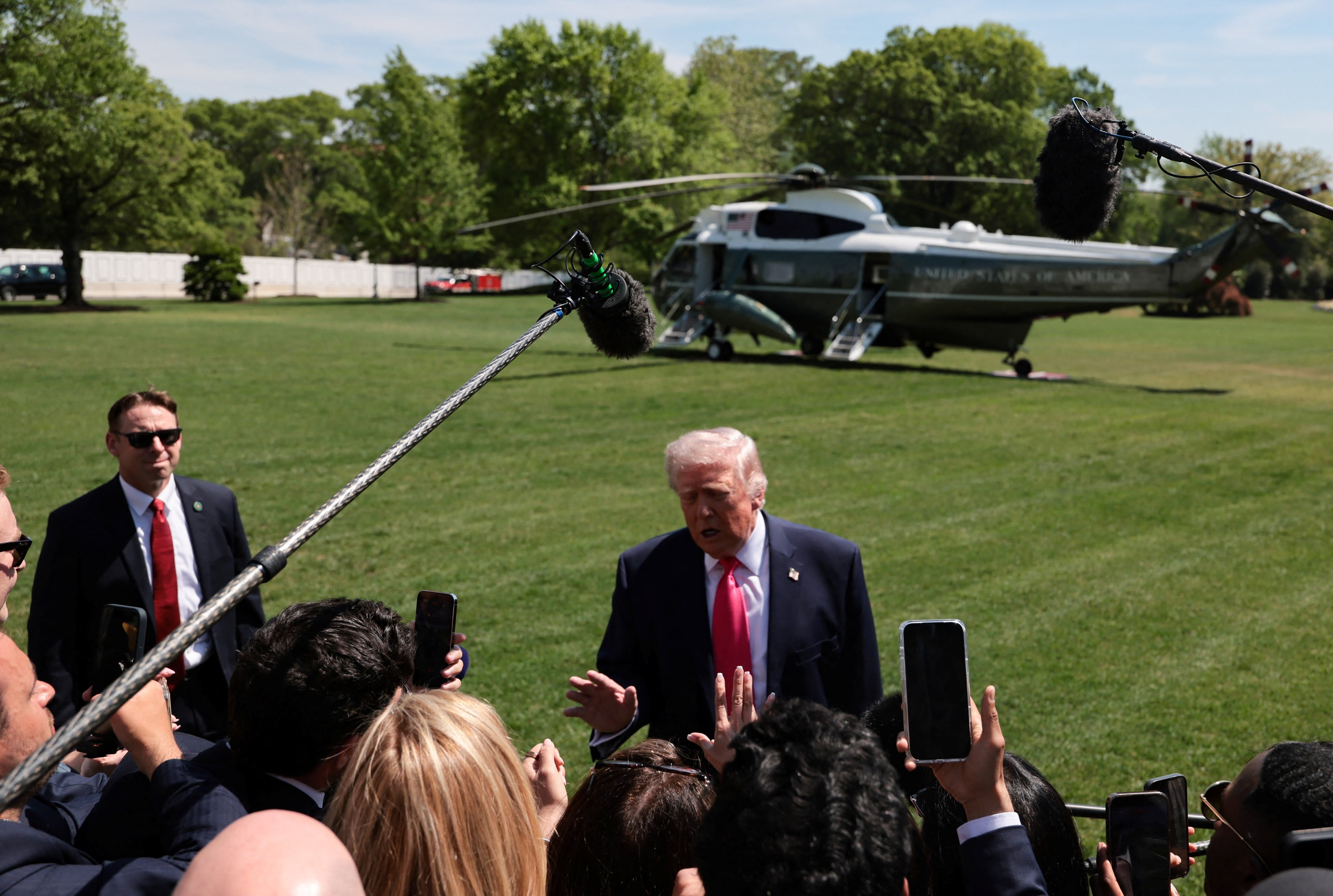 U.S. President Donald Trump speaks to the media as he departs the White House for Las Vegas in Washington April 16, 2026. 