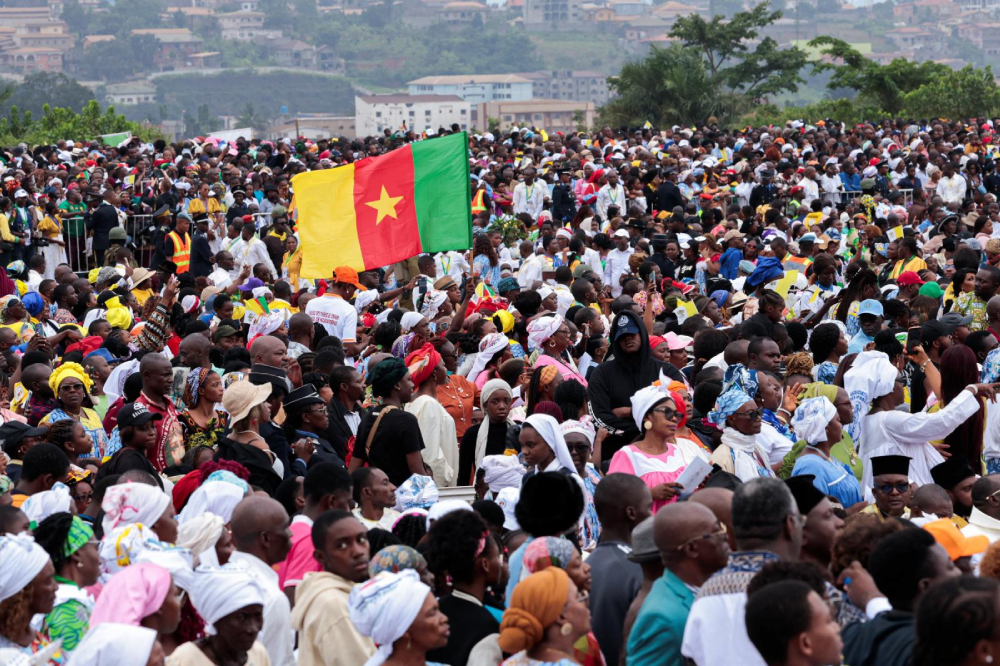 A Cameroonian flag flies as the faithful gather for a holy Mass led by Pope Leo XIV at Yaoundé-Ville air base in Yaoundé, Cameroon, April 18, 2026. (OSV News/Reuters/Luc Gnago)