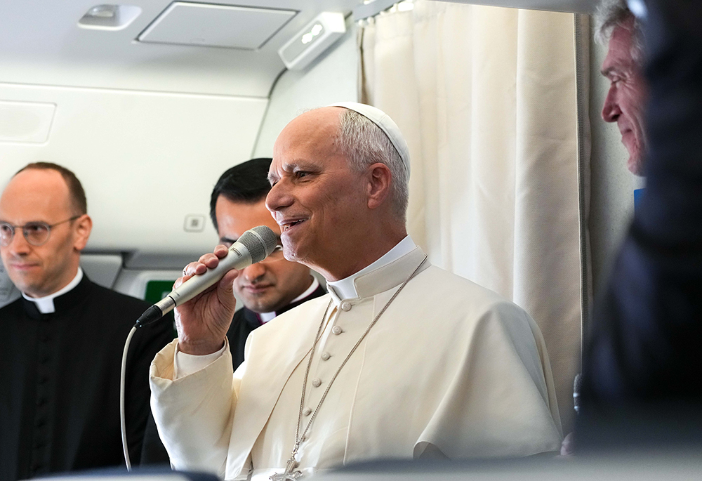 Pope Leo XIV answers questions from journalists during a news conference aboard the plane flying back to Rome after leaving from Equatorial Guinea, April 23, 2026. (CNS/Lola Gomez)