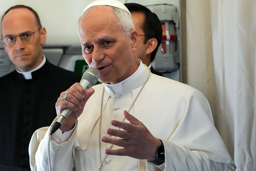 Pope Leo XIV answers questions from journalists during a news conference aboard the plane flying back to Rome after leaving Equatorial Guinea, April 23, 2026. (CNS/Lola Gomez)