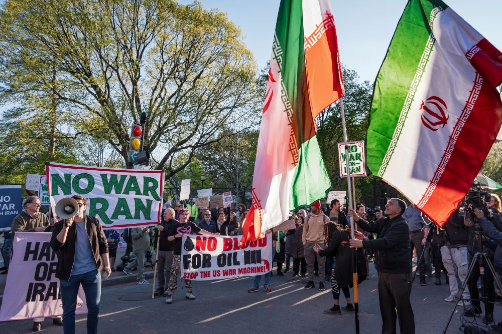Activists protest near the White House in Washington April 7. Earlier in the day President Donald Trump had doubled down on threats to annihilate Iran. (AP/J. Scott Applewhite)