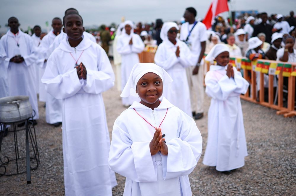 People wait for the beginning of a holy Mass by Pope Leo XIV at Yaoundé-Ville air base in Yaoundé, Cameroon, April 18, 2026. (OSV News/Reuters/Guglielmo Mangiapane)