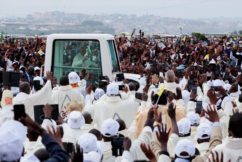 Pope Leo XIV greets faithful from the Popemobile on the day he celebrates Mass at Yaoundé-Ville air base in Yaoundé, Cameroon, April 18, 2026. (OSV News/Reuters/Luc Gnago)