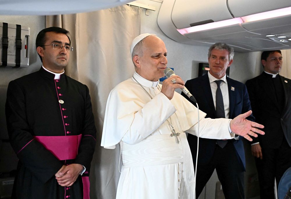 Pope Leo XIV speaks to journalists aboard a flight on his way to Luanda, Angola, April 18, 2026. On the flight from Cameroon to Angola, the pope pushed back against a media narrative that has pitted him against President Donald Trump since the start of his 11-day apostolic journey to Africa. (OSV News/Luca Zennaro, pool via Reuters)