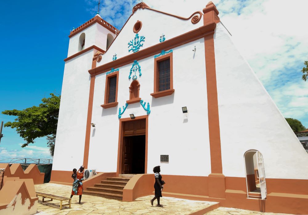 People walk by the Church of Our Lady of Muxima in Muxima, Angola, April 11, 2026. Pope Leo XIV is expected to visit the church, a hub of the Portuguese slave trade, during his 11-day pastoral visit to Africa. (AP)