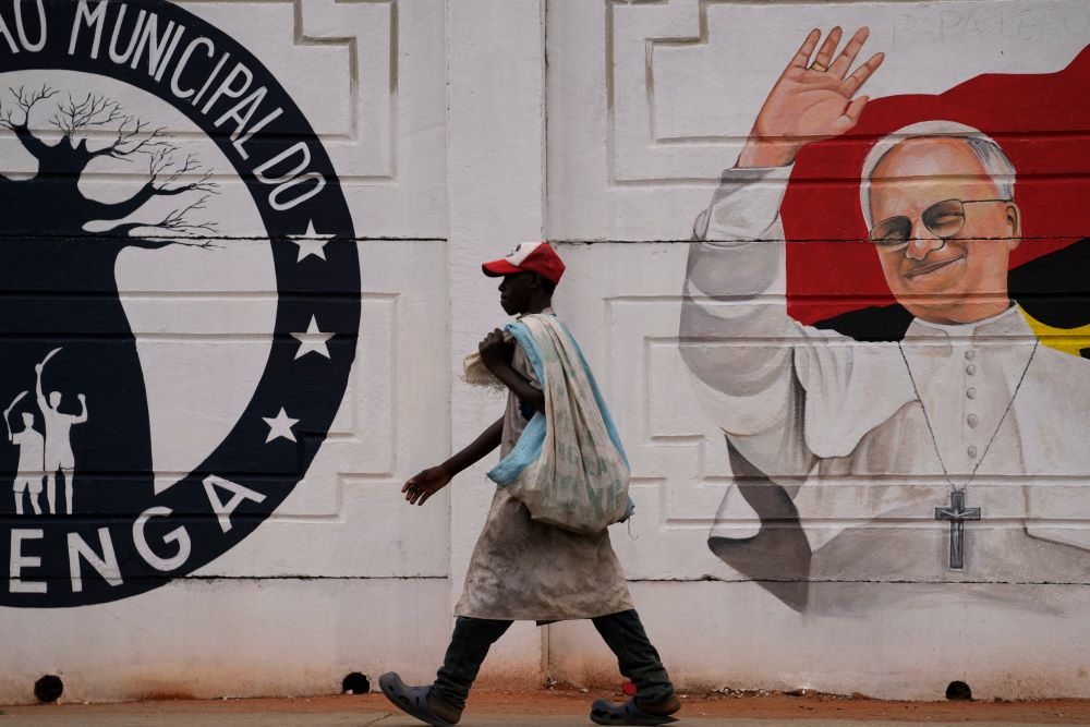 A man walks past a mural of Pope Leo XIV in Luanda, South Africa, April 16, 2026. Leo is expected to pray the rosary April 19 at the Church of Our Lady of Muxima in Angola as part of his11-day Africa tour. (AP/Themba Hadebe