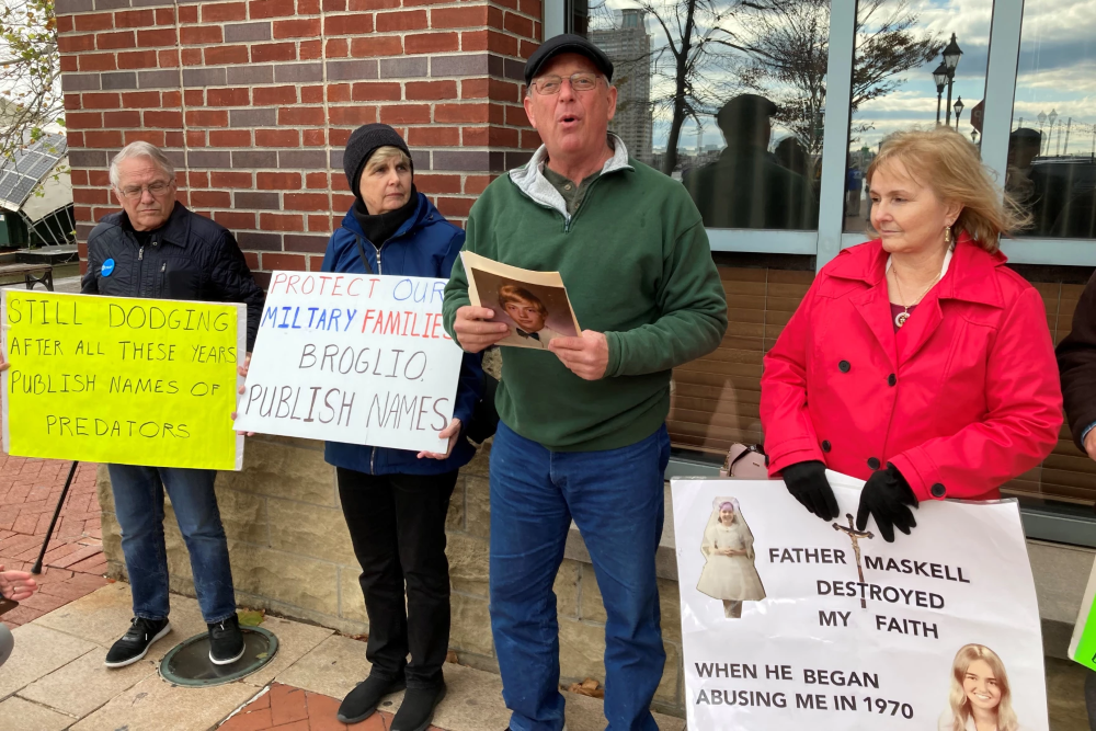 Former SNAP members protest outside the fall 2023 plenary assembly of the U.S. Conference of Catholic Bishops in Baltimore. From left to right are Frank Schindler, Judy Lorenz, David Lorenz and Teresa Lancaster. (Courtesy of David Lorenz)