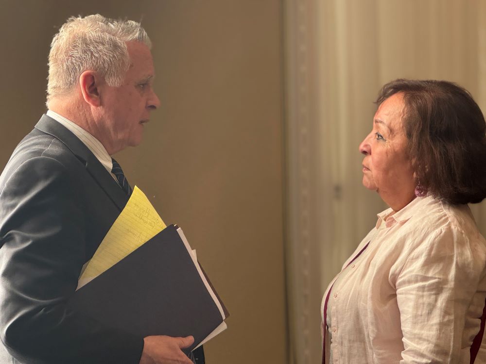 Consuelo Gómez, a Catholic mother from Maryland and head of MOVIR in the U.S., an organization for families of imprisoned Salvadorans who say they are innocent, talks to U.S. Rep. Chris Smith, also a Catholic from New Jersey, April 16, 2026, after a hearing at the Longworth House Office Building in Washington. (NCR photo/Rhina Guidos)