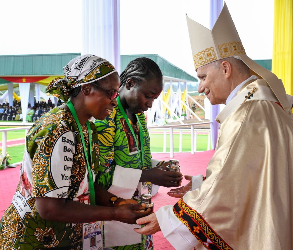 Pope Leo XIV receives the offertory gifts as he celebrates Mass at Bamenda International Airport in Cameroon April 16, 2026. (OSV News/Vatican Media/Simone Risolutii)