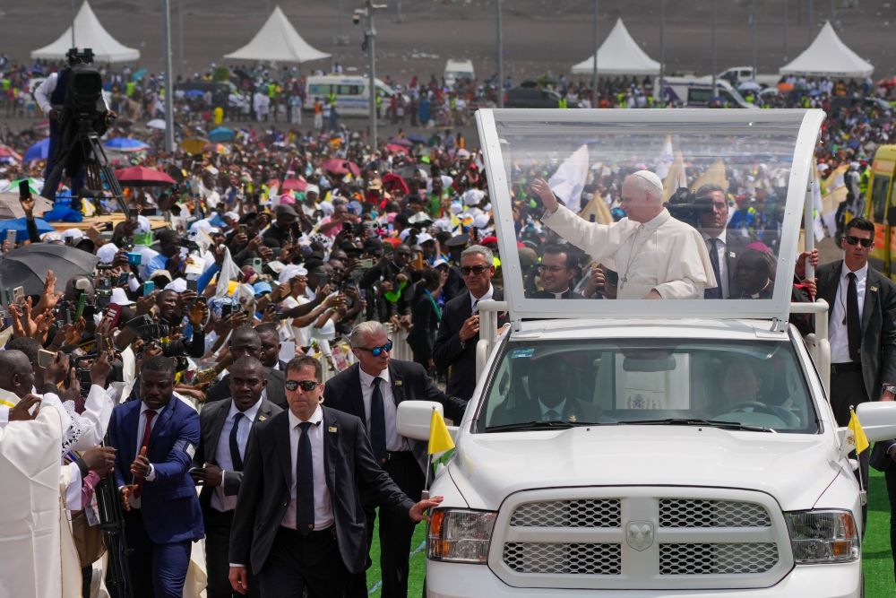 Pope Leo XIV waves to the crowds as he rides in the popemobile among the faithful as he arrives outside Japoma Stadium in Douala, Cameroon, April 17, 2026. (CNS/Lola Gomez)
