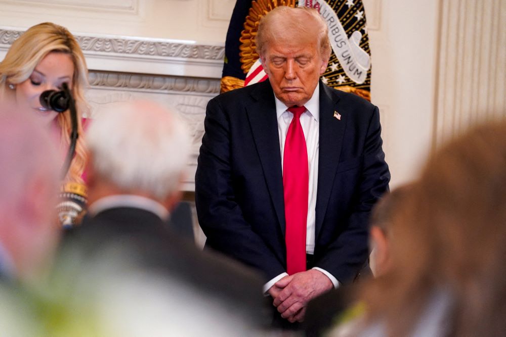 U.S. President Donald Trump takes part in a prayer, led by Paula White, senior adviser to the White House Faith Office, during the White House Faith Office Luncheon at the White House in Washington July 14, 2025. (OSV News/Reuters/Nathan Howard)