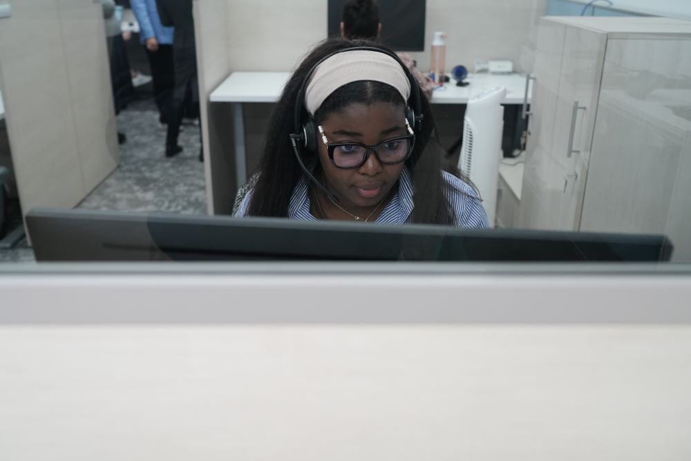 A volunteer works at a phone bank coordinated by Catholic Charities of the Archdiocese of New York to offer guidance and respond to local immigrants' concerns April 21. (Courtesy of Catholic Charities of the Archdiocese of New York)