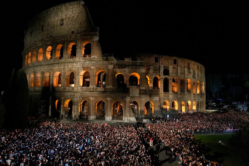 About 30,000 people encircled Rome's Colosseum with lit candles in hand as Pope Leo XIV led the Way of the Cross procession on Good Friday, April 3. (AP/Gregorio Borgia)