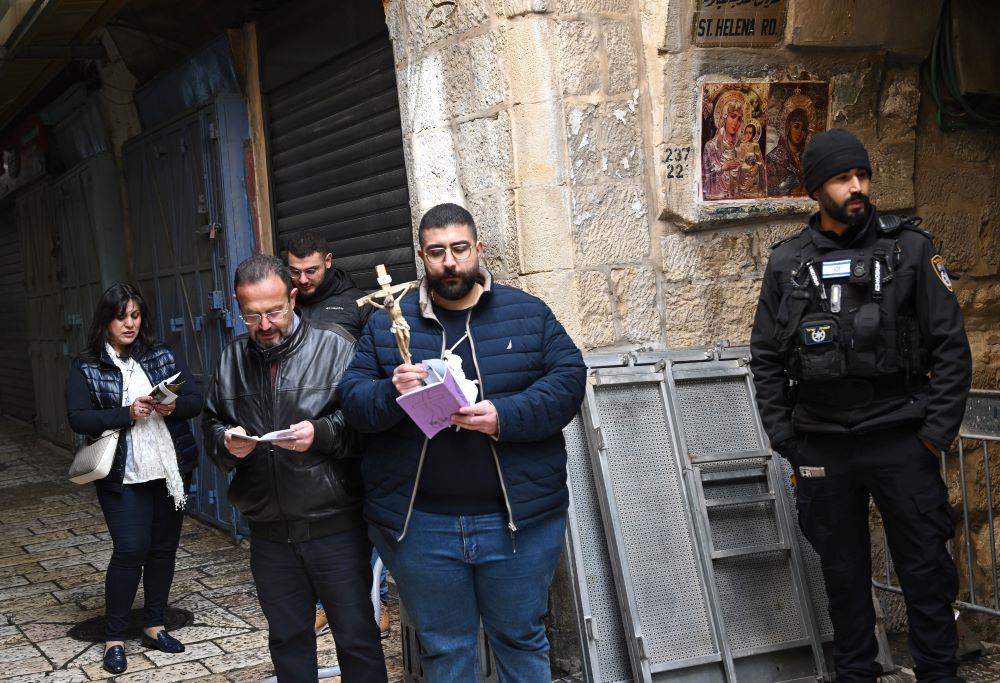 Israeli police stop Palestinian Catholics Yosef Kamar and his family from reaching the closed door of the Church of the Holy Sepulcher on Good Friday, in the Old City of Jerusalem, April 3. (OSV News/Debbie Hill)