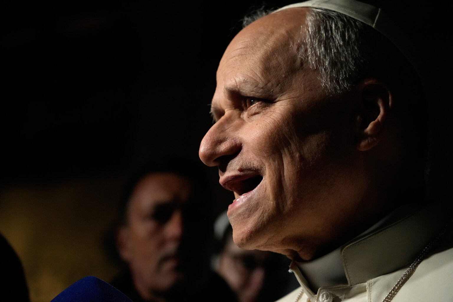 Pope Leo XIV talks to journalists as he leaves his residence in Castel Gandolfo, on the outskirts of Rome, to return to the Vatican, March 31. (AP/Gregorio Borgia)