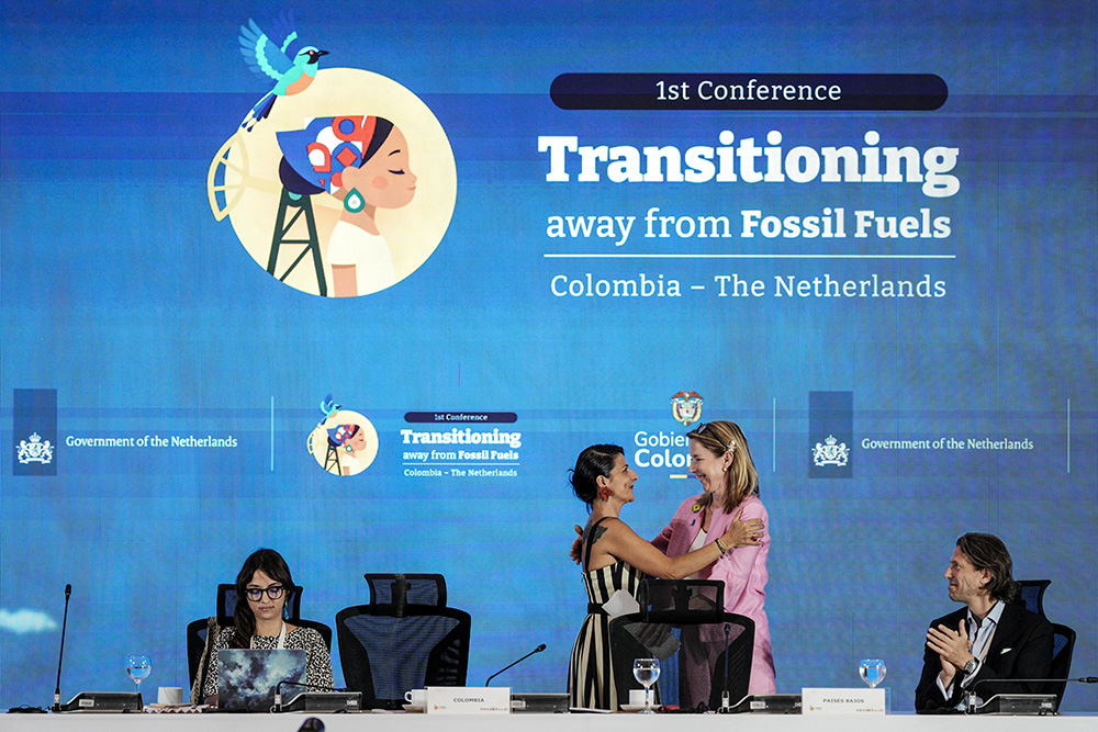 Stientje van Veldhoven, minister of Climate Policy and Green Growth of the Netherlands, right, embraces Colombia's Environmental Minister Irene Vélez Torres during a conference aimed at transitioning away from fossil fuels, on April 28, 2026, in Santa Marta, Colombia. (AP/Ivan Valencia)