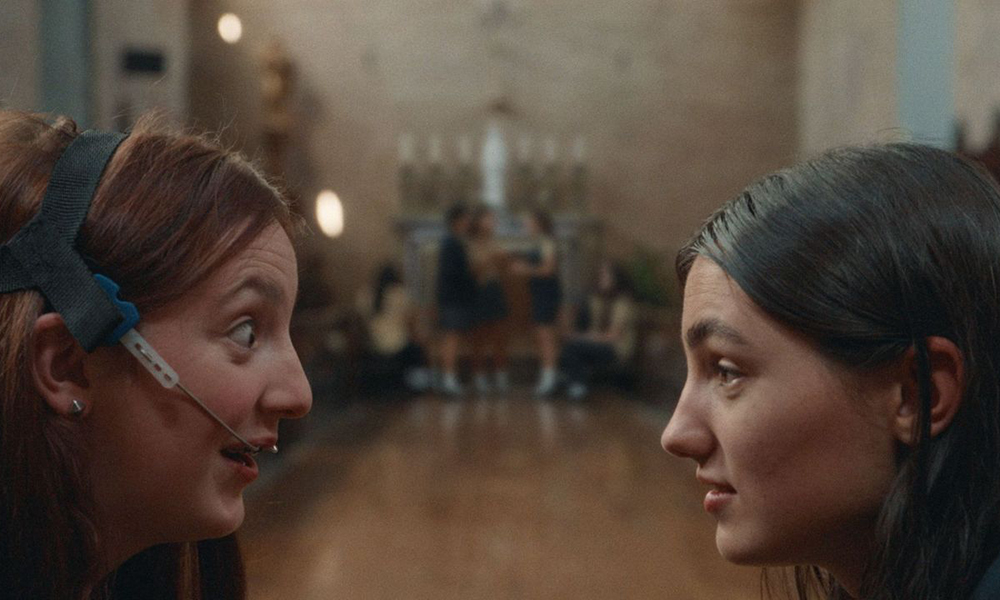 McKenna Tuckett, left, and Adi Madden Cabrera star in "Edie Arnold Is a Loser." "I realized that compared to other denominations, Catholicism is pretty goth. We love our bones, relics, blood … the imagery is so visceral. It has informed my creativity without me realizing it until this project," said director Megan Rico. (Katrina Wan PR)