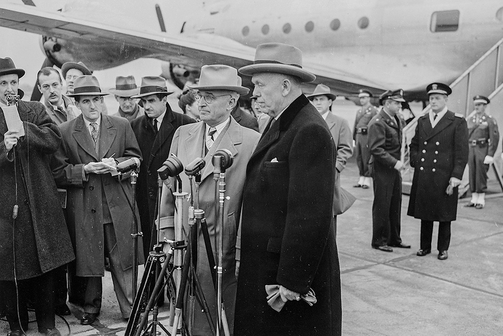 President Harry Truman and Secretary of State George Marshall speak to the press at the National Airport in Washington, D.C., Nov. 20, 1947. (Wikimedia Commons/National Archives and Records Administration)