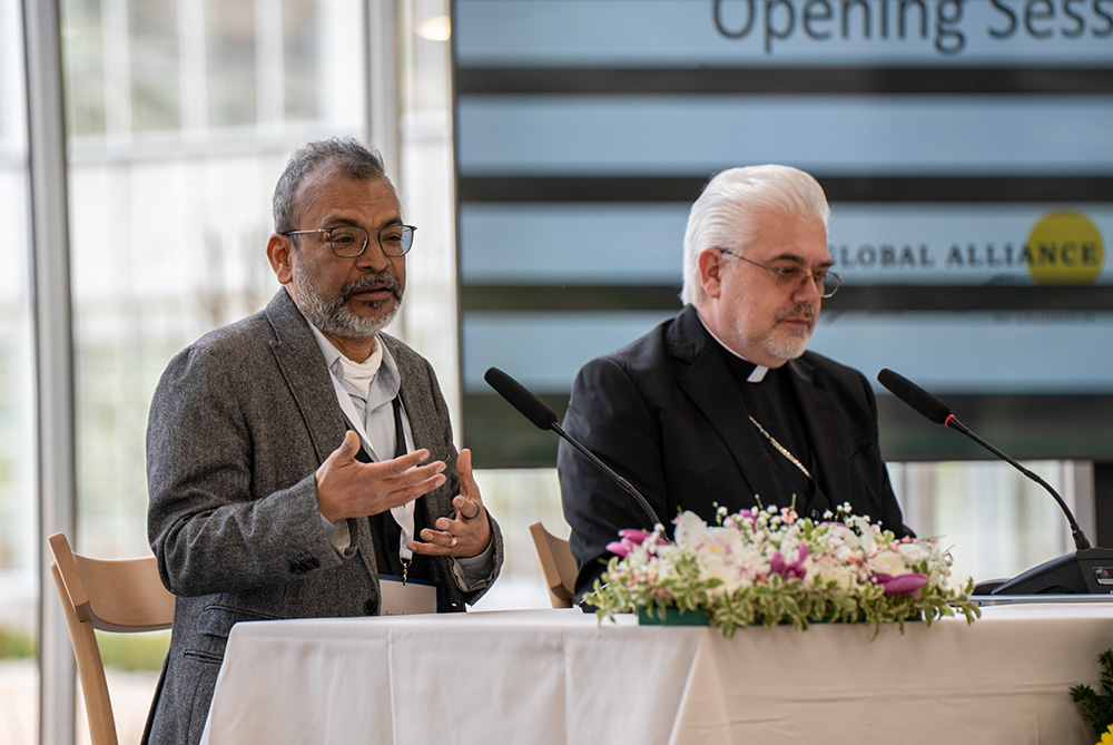 Arun Agrawal, left, a professor of sustainable development at the University of Notre Dame, speaks during a session of the first gathering of the Global Alliance on Laudato Si' held March 9-10, 2026, at Borgo Laudato Si' in Castel Gandolfo, Italy. Seated next to Agrawal is Cardinal Fabio Baggio, director of the Vatican's Laudato Si' Center for Higher Education. (Allesandro Sgarito)