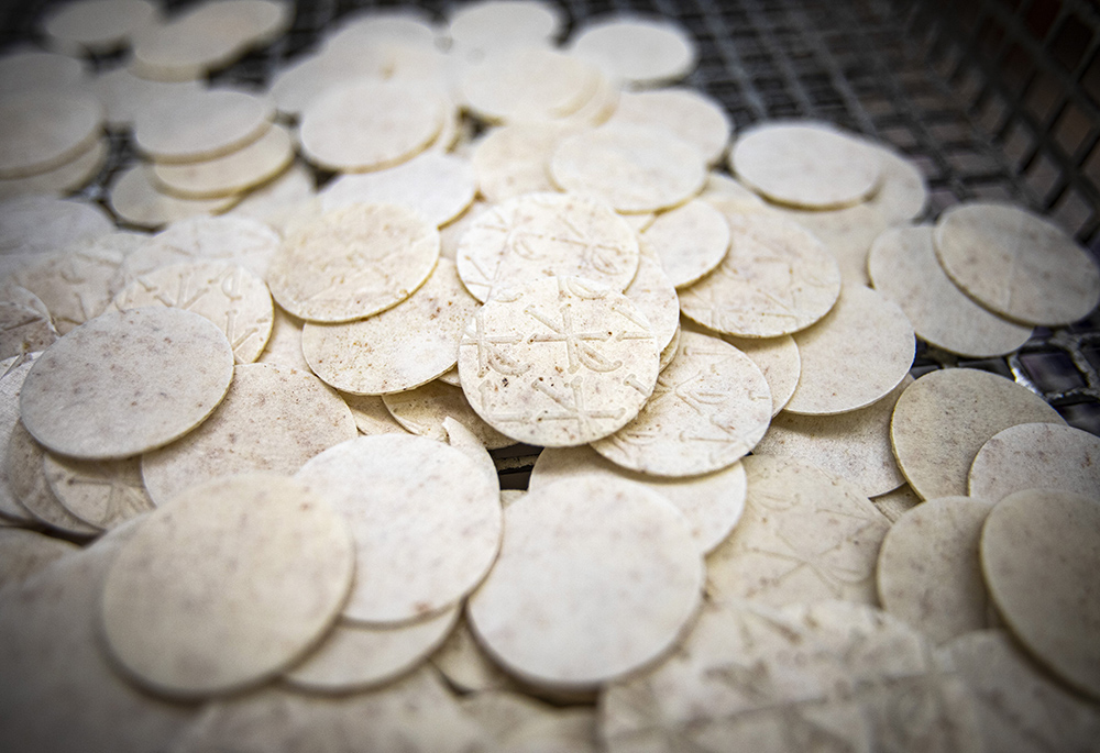 Freshly baked and cut altar bread is waiting to be sorted in the bakery at the Monastery of St. Clare in Langhorne, Pennsylvania, July 21, 2021. (OSV News/CNS/Chaz Muth)