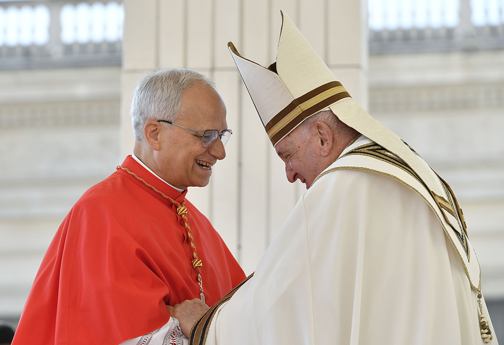 Pope Francis greets U.S.-born Cardinal Robert F. Prevost, prefect of the Dicastery for Bishops, after the cardinal spoke on behalf of himself and 20 other new cardinals created during a consistory in St. Peter's Square at the Vatican Sept. 30, 2023. (CNS/Vatican Media)