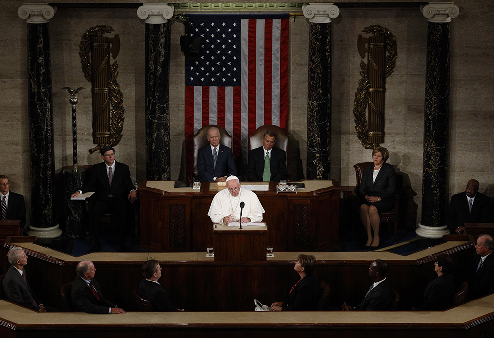 Pope Francis addresses a joint meeting of the U.S. Congress as Vice President Joe Biden, left, and Speaker of the House John Boehner look on in the House of Representatives Chamber at the U.S. Capitol in Washington Sept. 24, 2015. Pope Francis, formerly Argentine Cardinal Jorge Mario Bergoglio, died April 21, 2025, at age 88. (CNS/Paul Haring)