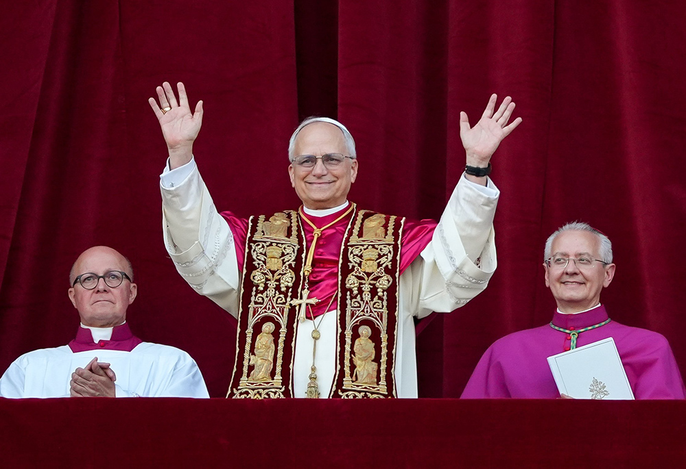 Pope Leo XIV, the former Cardinal Robert F. Prevost, waves to the crowds in St. Peter's Square at the Vatican after his election as pope May 8, 2025. (CNS/Lola Gomez)