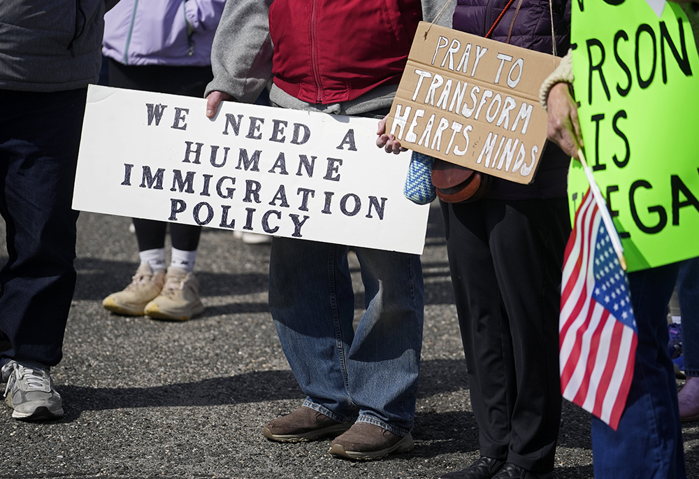 Protesters gather at a pro-immigrant rally on the campus of the U.S. Citizenship and Immigration Services field office in Holtsville, New York, April 12, 2026. Demonstrators were protesting a proposed detention facility inside the field office that would be used to hold immigrants taken into custody by ICE officers. (OSV News/Gregory A. Shemitz)