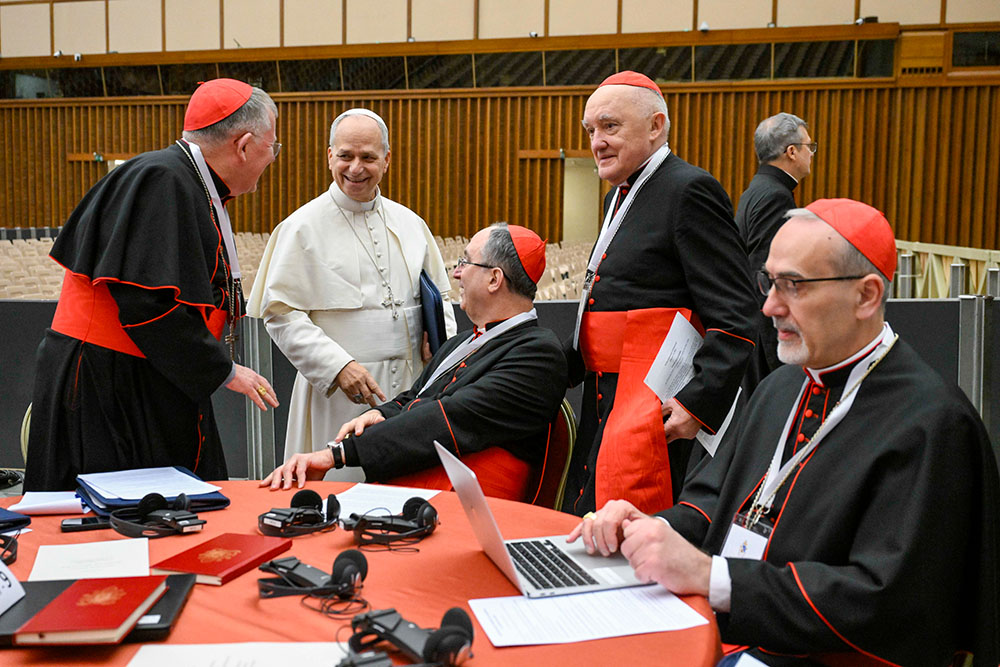 Pope Leo XIV shares a light moment with cardinals Jan. 8, 2026, during a consistory at the Vatican Jan.7-8. (OSV News/Vatican Media/Simone Risoluti)