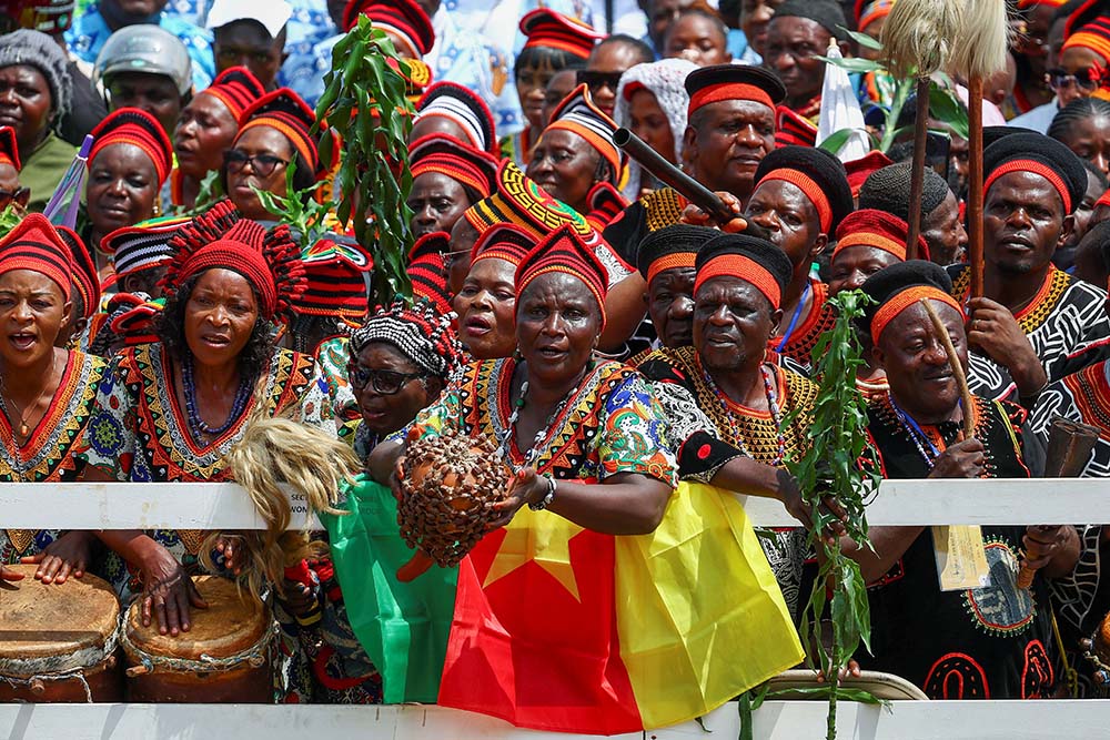 People gather outside St. Joseph's Cathedral in Bamenda, Cameroon, April 16, 2026, as they wait for the arrival of Pope Leo XIV for a Meeting for Peace. (OSV News/Reuters/Guglielmo Mangiapane)