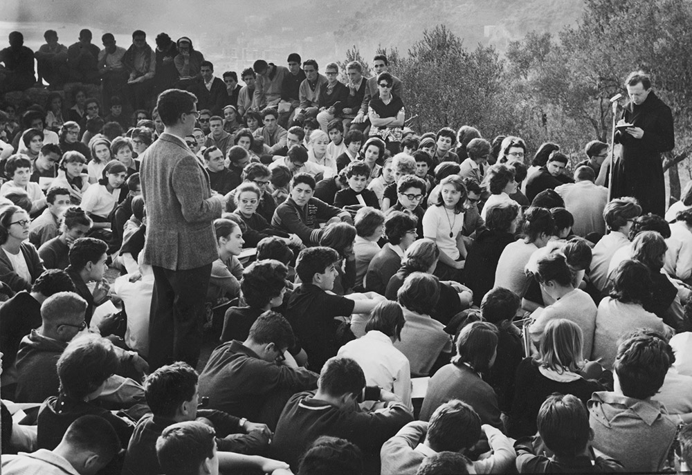 Msgr. Luigi Giussani, founder of the lay movement Communion and Liberation, meets with students in 1963. (OSV News file/Courtesy of Communion and Liberation)