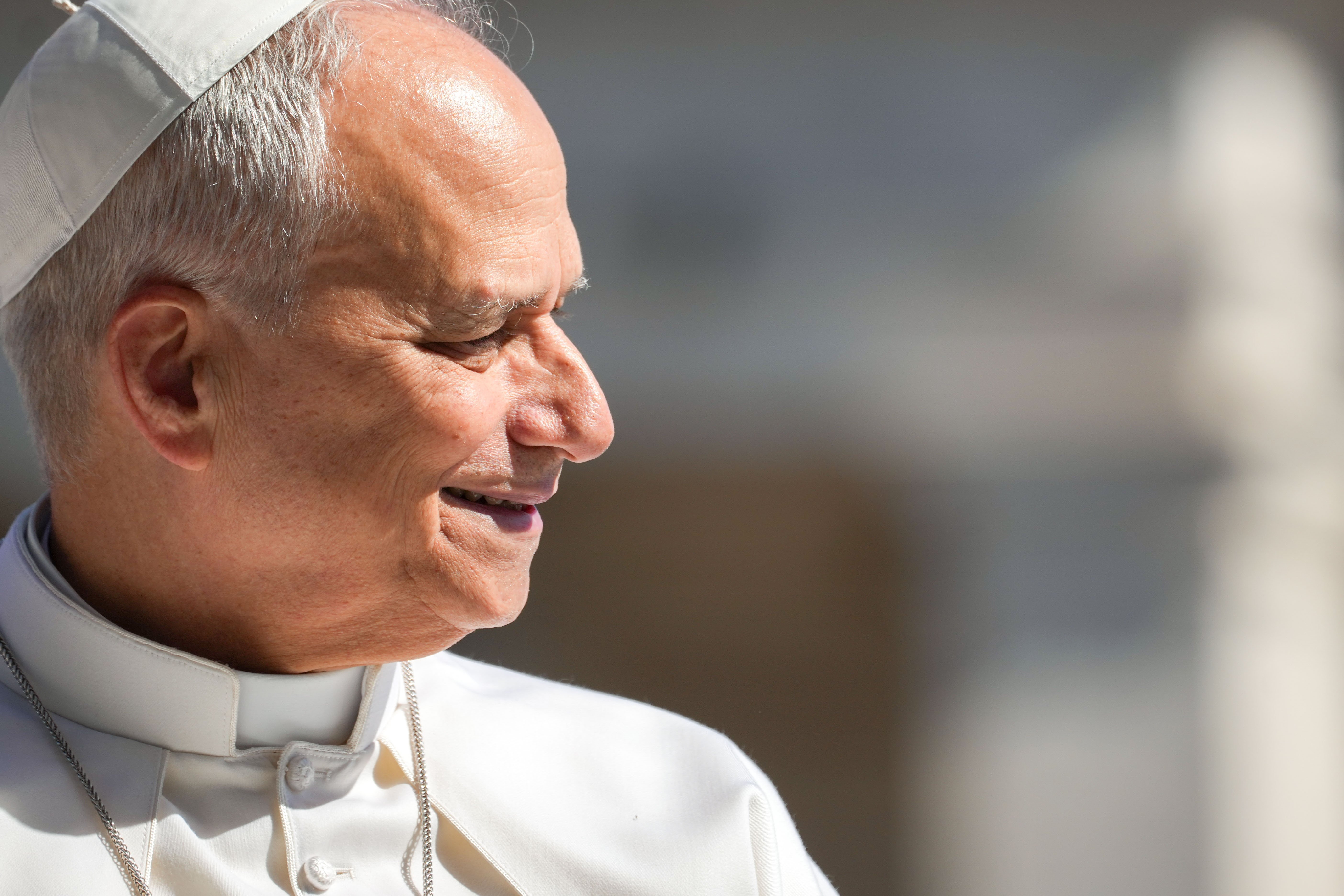 Pope Leo XIV smiles as he greets visitors and pilgrims from the popemobile while riding around St. Peter’s Square at the Vatican before his weekly general audience May 20, 2026. (CNS photo/Lola Gomez)