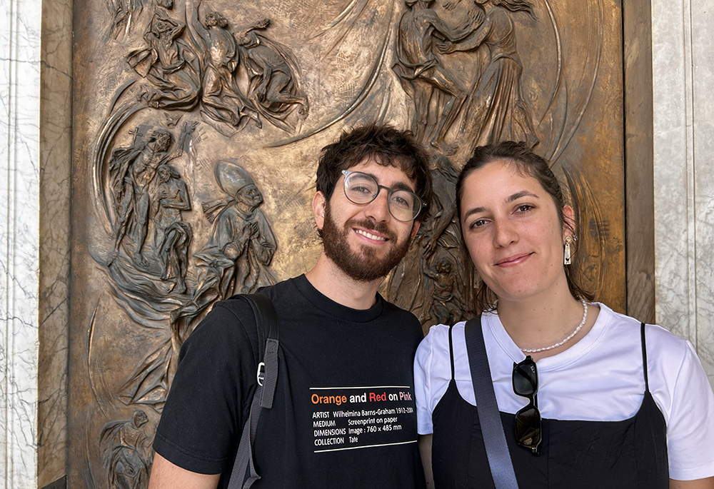 Argentine pilgrims Mateo, left, and Valentina, right, pose for a photo outside the Basilica of St. Mary Major in Rome. (NCR photo/Justin McLellan)