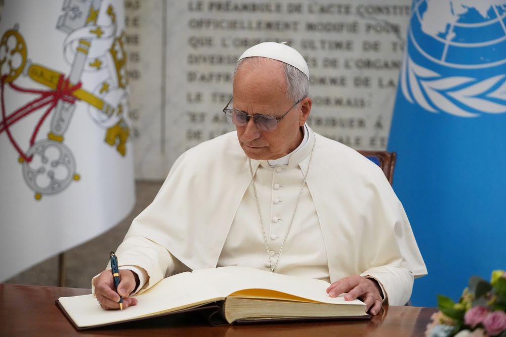 Pope Leo XIV signs the FAO Golden Book register of honor as he attends a ceremony marking the 80th anniversary of World Food Day at the FAO headquarters in Rome on Oct. 16, 2025. (AP/Alessandra Tarantino, file)