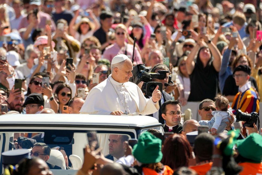Pope Leo XIV greets visitors and pilgrims from the popemobile while riding around St. Peter's Square at the Vatican before his weekly general audience May 20, 2026. (CNS/Lola Gomez)