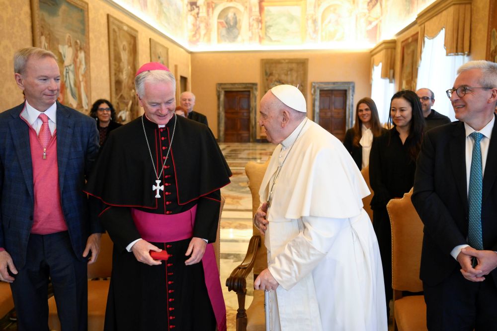 Pope Francis greets Bishop Paul Tighe, secretary of the Dicastery for Culture and Education, during a meeting with leaders from the tech industry at the Vatican March 27, 2023. Tigh co-authored the Vatican document "Antiqua et Nova" on the relationship between AI and human intelligence. (CNS/Vatican Media)