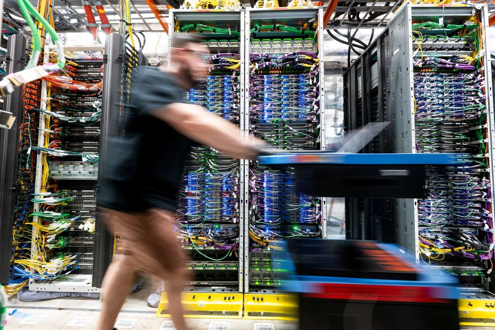 A technician works at an Amazon Web Services data center in Hermiston, Ore., May 9, 2025. The explosion of massive data centers to handle the increasing generative demands of artificial intelligence have placed high demands on both power and the water used in cooling systems. Low-income communities have typically endured the brunt of the air pollution they create. (OSV News/Reuters/Noah Berger for AWS)