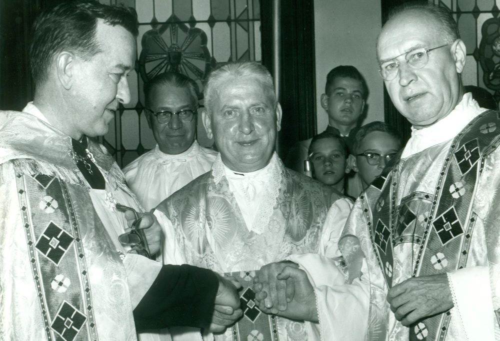 Jesuit Fr. Walter Ciszek, center, is welcomed home in a Mass of Thanksgiving in St. Casimir Catholic Church, Shenandoah, Pennsylvania, following his release from the former Soviet Union, where he was imprisoned and detained for more than 20 years. (Courtesy of Ciszek Society)